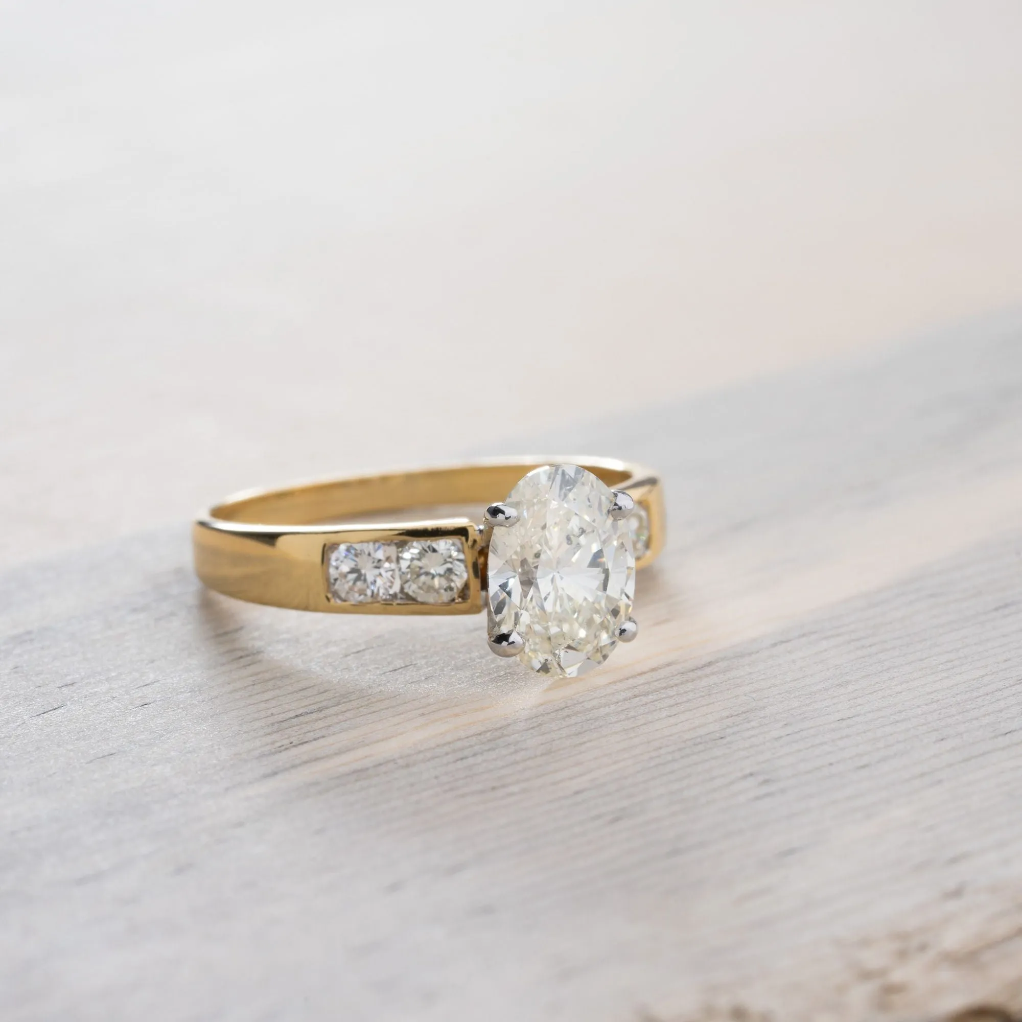 Oval Cut Diamond Engagement Ring in 18K Yellow and White Gold